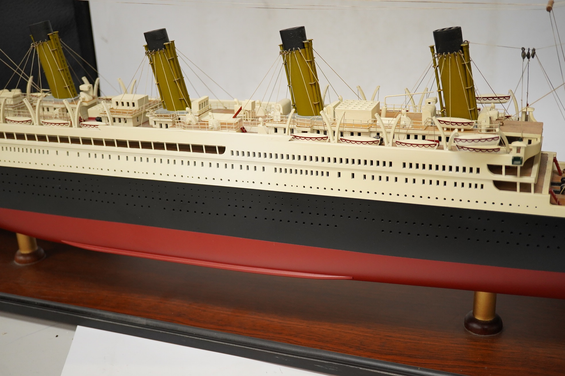 An 'Authentic Models' model of the ocean liner RMS Titanic, on stand, 100cm long. Condition - good.